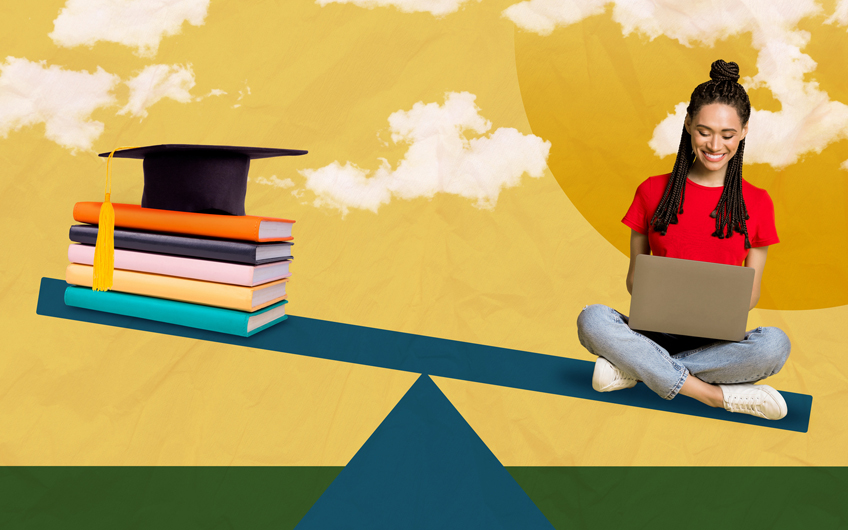 A young woman sits on one side of seesaw with a laptop in her lap. Balancing on the other side is a stack of books with a graduation cap on top.